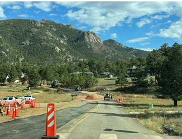 Zoomed out photo of a road that has been and is currently being worked.